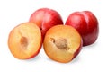 Red round plums. Whole and halves. White isolated background.