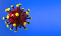 Red round virus cell Chinese pathogen respiratory flu coronavirus COVID-19 on blue background. Creative concept