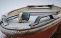 red rowing boat with blue padlock filled with frozen water Royalty Free Stock Photo