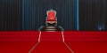 Red royal chair on a background of black curtains. Royalty Free Stock Photo