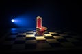 Red royal chair miniature on wooden table. Medieval Throne on chessboard. Chess board game concept of business ideas and