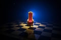 Red royal chair miniature on wooden table. Medieval Throne on chessboard. Chess board game concept of business ideas and