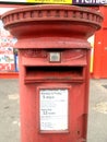 A red Royal Mail post box