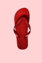 Red rubber flip flops, isolated on pink background Royalty Free Stock Photo