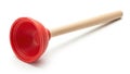Red rubber plunger with a light wooden handle on a white background Royalty Free Stock Photo