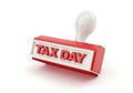 Red rubber stamp with tax day imprinted on a white background Royalty Free Stock Photo
