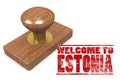 Red rubber stamp with welcome to Estonia