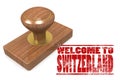 Red rubber stamp with welcome to Switzerland