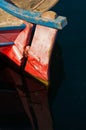 Red rudder of an old fishing boat and its reflection Royalty Free Stock Photo