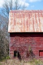 Red Run-Down Barn in Woods Royalty Free Stock Photo