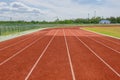 Red Running track with corner of the football field Royalty Free Stock Photo