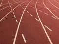 Red running tracks with white lines Royalty Free Stock Photo