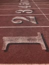 Red running tracks with white lines Royalty Free Stock Photo