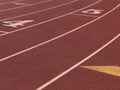 Red running tracks with white lines Royalty Free Stock Photo