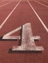 Red running tracks with white lines Royalty Free Stock Photo