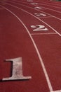 Red running tracks with white lines Royalty Free Stock Photo