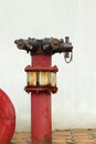 Red rusty metal industrial water pipes with a valve. Royalty Free Stock Photo