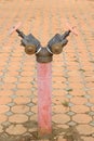 Red rusty metal industrial water pipes with a valve. Royalty Free Stock Photo