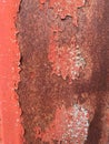 Red rusty metal wall background with cracked paint Royalty Free Stock Photo