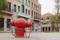 Red rusty traditional vintage retro style fire hydrant standing