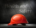 Red safety helmet on steel