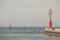 Red safety light beacons on the sea