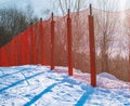 Red safety net at the edge of an alpine skiing slope Royalty Free Stock Photo