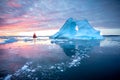 Red sailboat cruising among icebergs. Royalty Free Stock Photo