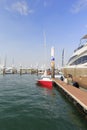 Red sailboat moored in the marina Royalty Free Stock Photo