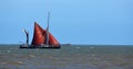 Red Sailed Barge sailing just off Suffolk coast. Royalty Free Stock Photo