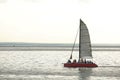 Red sailing catamaran. Royalty Free Stock Photo