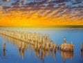 Saline lake with remains of an old constructions at the sunset Royalty Free Stock Photo