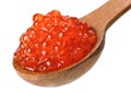 Red salmon caviar heap in wooden spoon Royalty Free Stock Photo