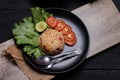 Red salted egg fried rice with vegetables in black plate Royalty Free Stock Photo