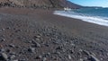 Red sand beach located on the island of El Hierro.