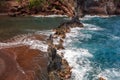 Red Sand Beach, Maui in in Hawaiian. Sea Wave and rock, summer beach background. Royalty Free Stock Photo