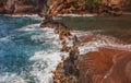 Red Sand Beach, Maui in in Hawaiian. Sea Wave and rock, summer beach background. Royalty Free Stock Photo