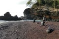 Red sand beach rock stacks Royalty Free Stock Photo