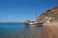 Red sand beach with ship, Rhodes Royalty Free Stock Photo