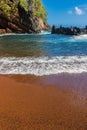 Red Sand And Blue Waves of Kaihalulu Beach