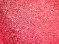 Red sand close up. sand texture orange treadmill. Texture of dry red clay with stones Royalty Free Stock Photo