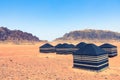 Red sand desert and Bedouin camp at sunny summer day in Wadi Rum, Jordan. Middle East Royalty Free Stock Photo