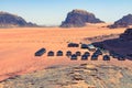 Red sand desert and Bedouin camp at sunny summer day in Wadi Rum, Jordan. Middle East Royalty Free Stock Photo