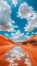 Red Sand Dune With Clouds Reflected in Water Royalty Free Stock Photo