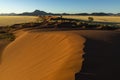 Red sand dunes and kopjes in the Namib Desert Royalty Free Stock Photo
