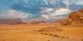 Red sands mountains, dramatic sky and marthian landscape panorama of Wadi Rum desert, Jordan Royalty Free Stock Photo