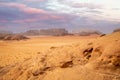 Red sands mountains, dramatic sky and marthian landscape panorama of Wadi Rum desert, Jordan Royalty Free Stock Photo