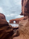 Red sandstone cliffs under an overcast sky at Cavendish Beach, Prince Edward Island, Canada Royalty Free Stock Photo