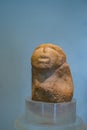 Red sandstone prehistoric figurine