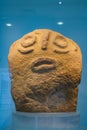 Red sandstone prehistoric figurine